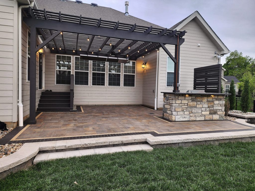 Paver patio with pergola and outdoor kitchen in Chesterfield, Missouri