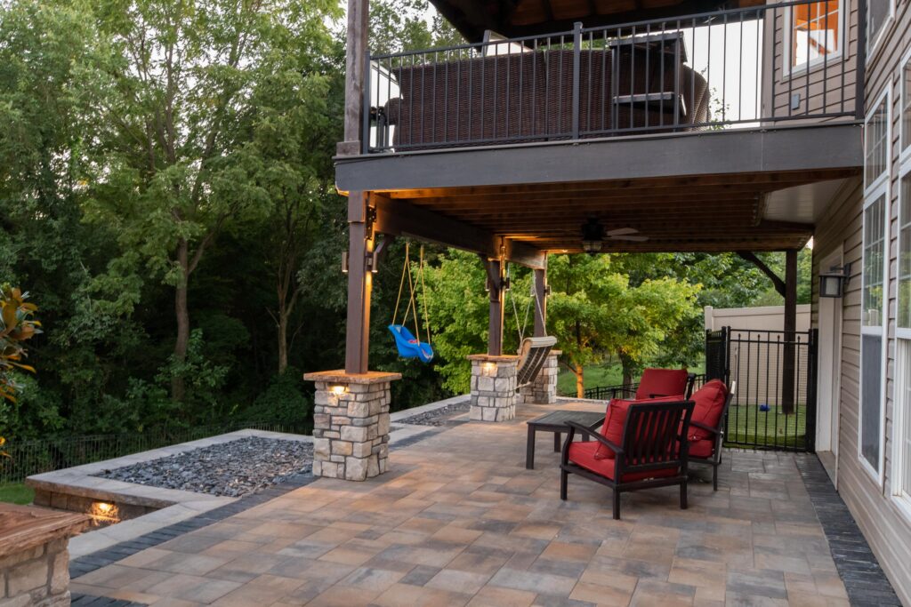 Paver patio in Maryville Illinois with stone columns and outdoor kitchen.