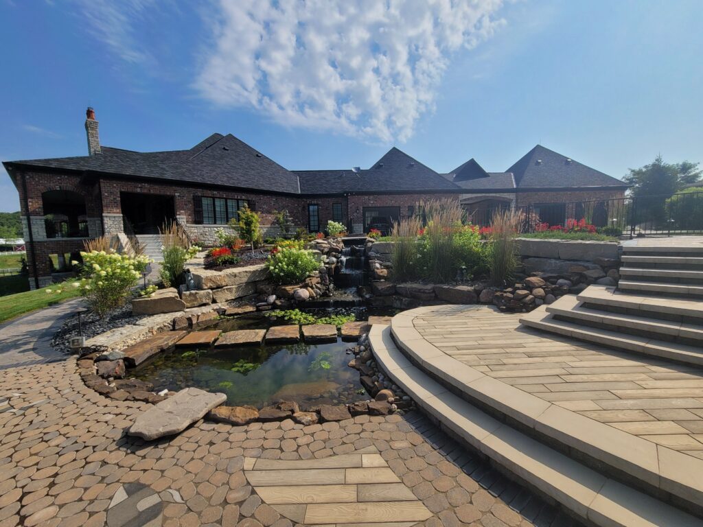 Natural stone waterfall and koi pond landscaping in Columbia, Illinois