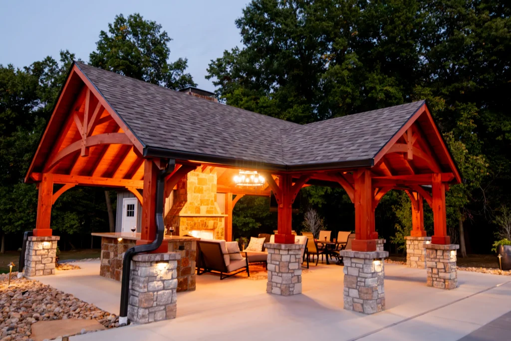 Cedar timber pavilion with outdoor kitchen and full masonry fireplace in Edwardsville Illinois.